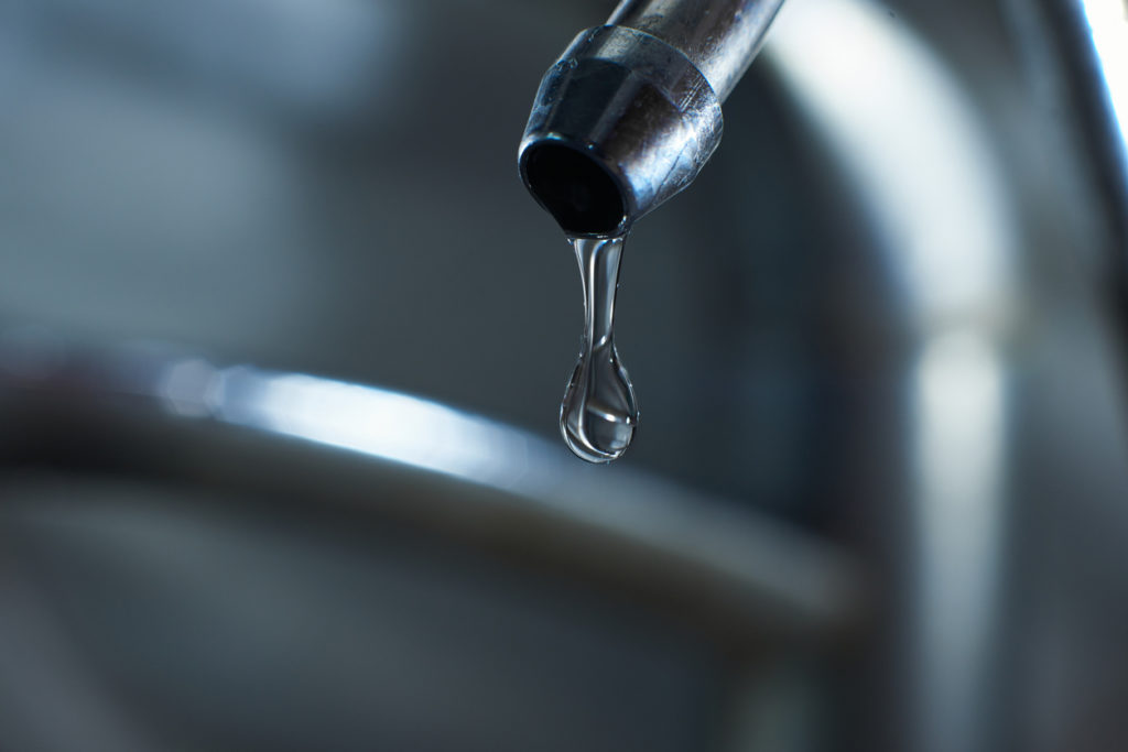 tap water slowly dripping out of a reverse osmosis faucet in san diego