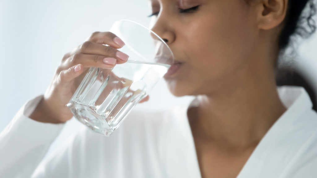 Woman drinking San Diego tap water