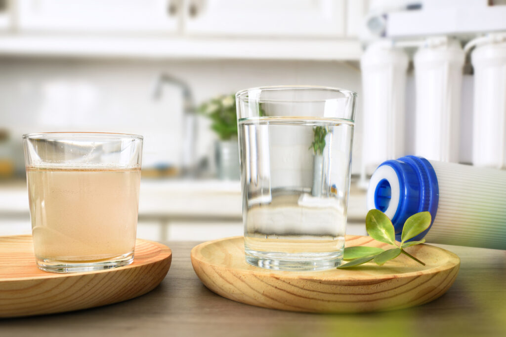 Glasses of water sitting on wooden plates in a home in San Diego 