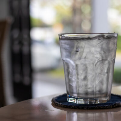 glass of water that is somewhat cloudy due to pH levels